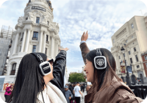 silent party with headphones in madrid streets